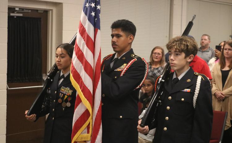 Pictured above (from left to right): HCHS students Melina Sanchez, Eddie Franco, and Caleb Carter present the colors during the BOE’s meeting on Veterans Day.