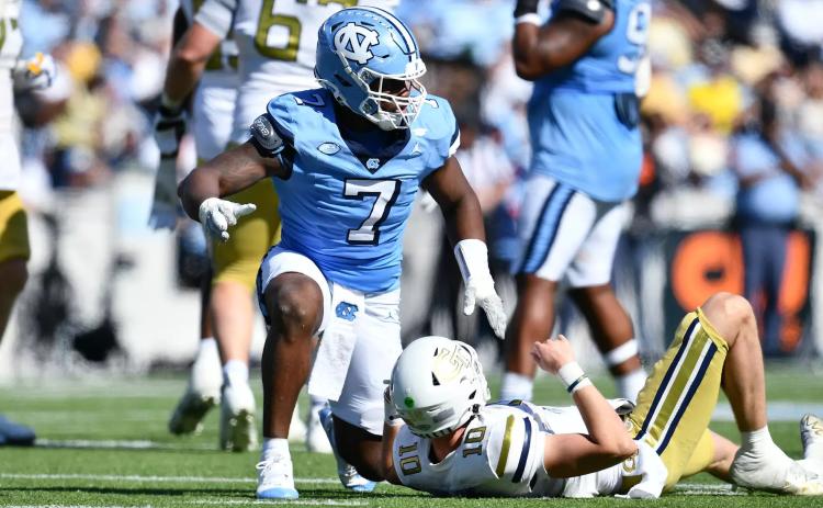 Former Hart County and current UNC edge rusher Kaimon Rucker pressures Georgia Tech’s quarterback Haynes King in the 41-34 loss to the Yellow Jackets in Chapel Hill on Oct. 12. Photo by Anthony Sorbellini/UNC Athletics