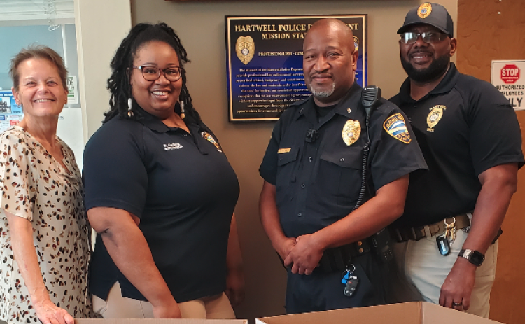 Hartwell Police employees stand next to the Toys for Tots collection boxes. Pictured above (from left to right): Renae Pierce, Roshunda Gaines, Lt. Darin Rucker, and Lt. Sherod Blackwell.