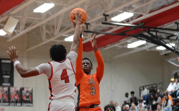 Senior guard Andrew Maxwell gets the tear dropper to go over a Red Raider defender in the 68-61 loss to Madison.