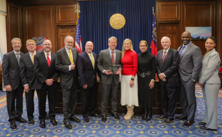 Governor Brian Kemp accepts the award for Georgian of the Year by the Georgia Association of Broadcasters.
