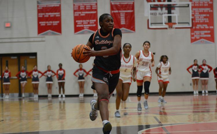 Junior guard Kiasia Montgomery (pictured) scores 31 points and senior guard TK Smith scores 36 points in the past two games to elevate the Lady Dogs to a 3-1 start.