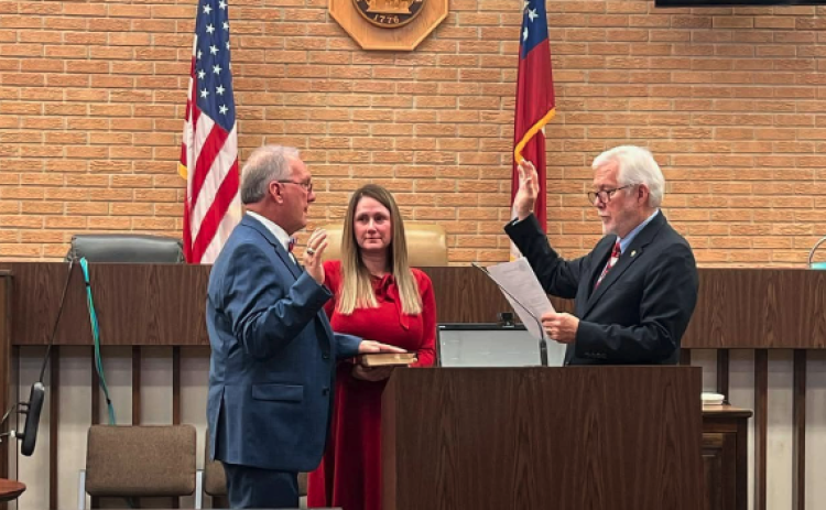 Judge J. Christopher NeSmith (left) was sworn in as a judge on the Superior Court of the Northern District of Georgia Dec. 20. NeSmith was sworn in by retired Chief Judge John Bailey (right).
