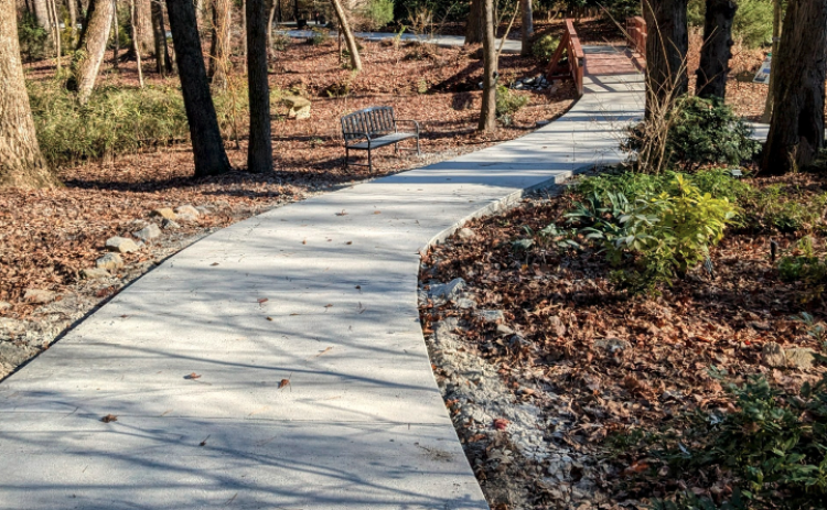 The new concrete path extends through the perimeter of the Hart County Botanical Garden allowing wheelchair and stroller access.