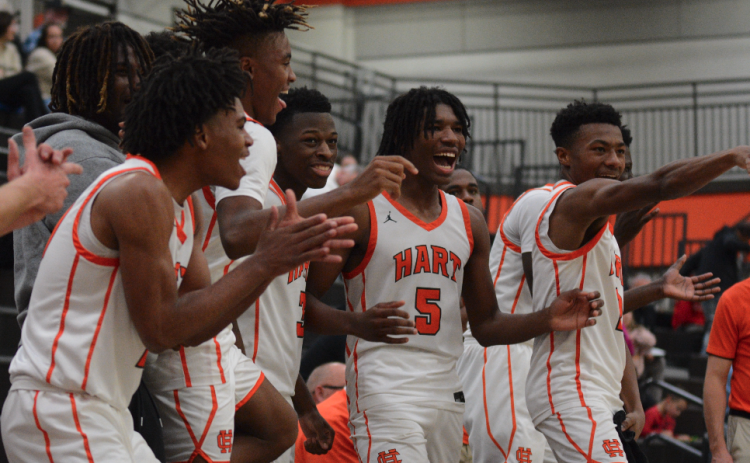 The Dogs bench celebrates after a big three late in 79-52 win over Pendleton as they would then go onto defeat Elbert County, 69-57 to win the McDonald’s Shootout Championship.