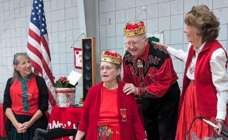 Bob and Lorrie Morrison were crowned the “King and Queen of Square Dance” by Sheryl Cantwell (right), Lorrie Morrison (left) and the Swingin Harts Square Dancers of Hartwell for their 25 years of calling dances for the club.