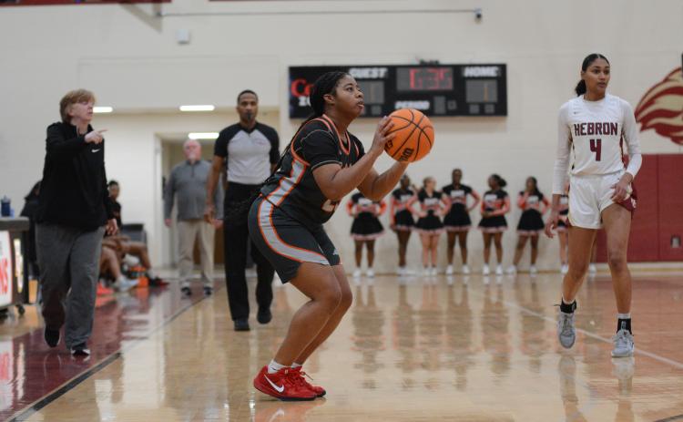 Senior guard TK Smith hits a three from the right corner in the 79-26 loss against Hebron.