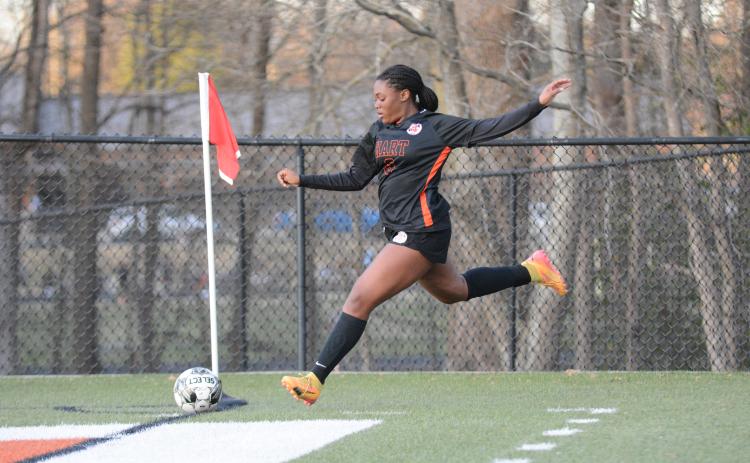 Sophomore defender Aidyn Craft sends a corner into play and later scored a goal as the Lady Dogs claimed a 11-1 win over the Lady Patriots of Westside Augusta on Feb. 21.