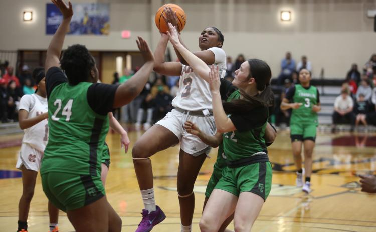 Junior forward Kiasia Montgomery led the way for the Lady Dogs as she scored 25 points against the Lady Lions of Franklin County to advance to the Region 8-AA Championship.