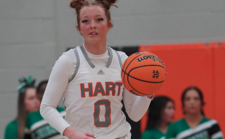 Senior guard Channing Segars dribbles the ball across the timeline in the 54-38 win over Franklin County. Photo submitted by DJ Groves.