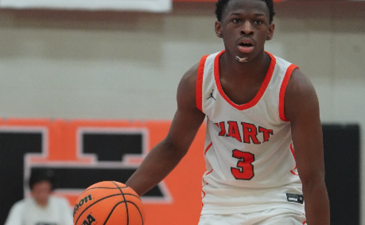 Senior guard Andrew Maxwell brings the ball up the court in a 75-67 overtime thrilling win over Franklin County. Photo submitted by DJ Groves.