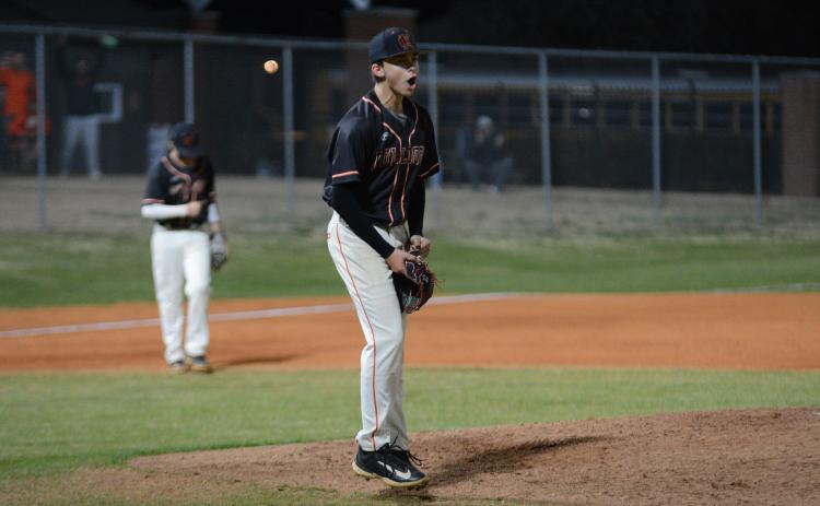 Freshman pitcher Aiden Kennedy celebrates after the final out in the 4-3 win over the Warriors of Oconee County.