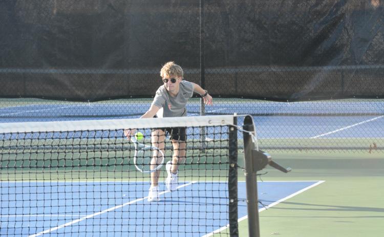 Ayden Mercer returns a serve in the 5-0 loss to Stephens.
