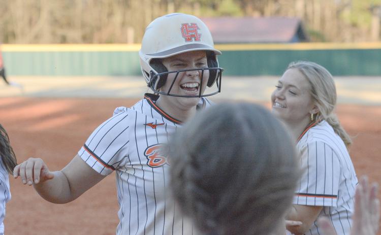 Sophomore Chesnee Strickland celebrates with her teammates moments after a walkoff double in the 11-10 win over the Lady Dragons of Jefferson on March 12. (Photo/Benjamin London)