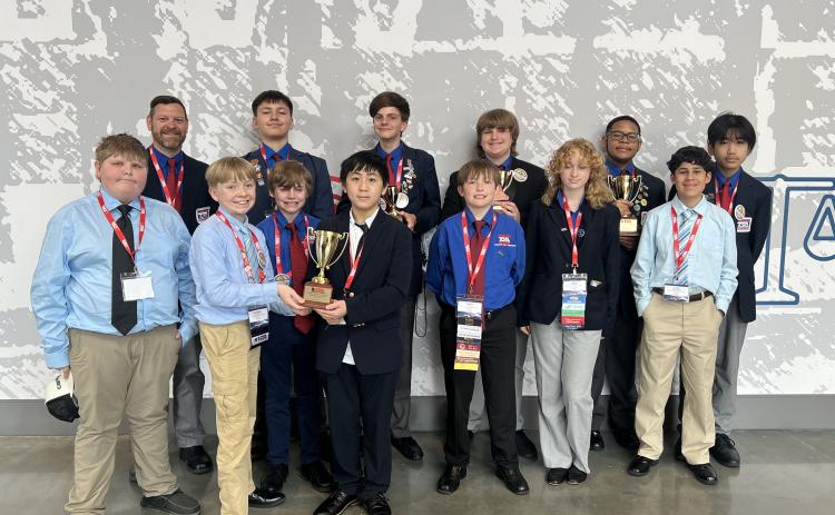 Pictured are the Hart County Middle School TSA students who recently attended the 2025 Georgia TSA State Conference: (front row, L-R) Easton Saylors, Nathaniel Metzger, John Bryant, Chance Vang, Connor Lewis, Kenzie McDuffie and Steve Franco; (back row, L-R) Joshua McCurley (advisor), Case Cothran, Henley Skelton, Garrett Ray, Jyrese Quillian and Johnson Dang. (Photo/Grayson Williams)