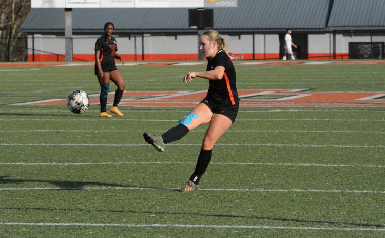 Senior midfielder Teague Pierce pops in a goal from long range in the 10-0 win over the Lady Rams of Monsignor Donovan on March 14. (Photo/Benjamin London)