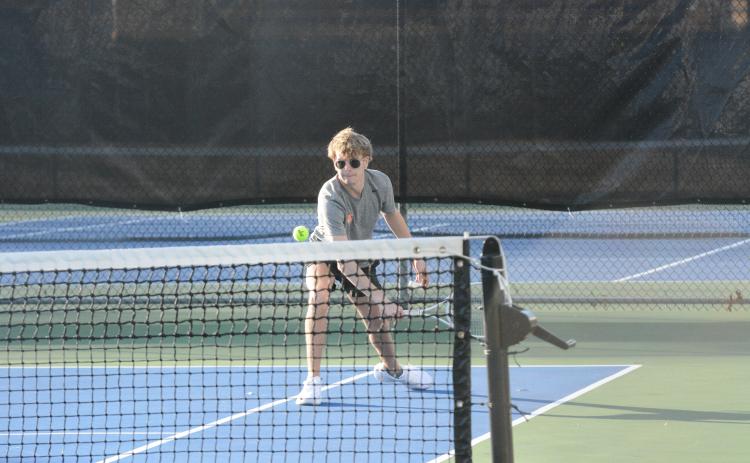 Senior Ayden Mercer returns the serve in a match earlier in the season, as he helped propel Hart County to a 3-1 win over East Jackson with a 7-5, 6-2 win at No. 1 doubles in the first round of the region tournament on April 15. (Photo/Benjamin London)