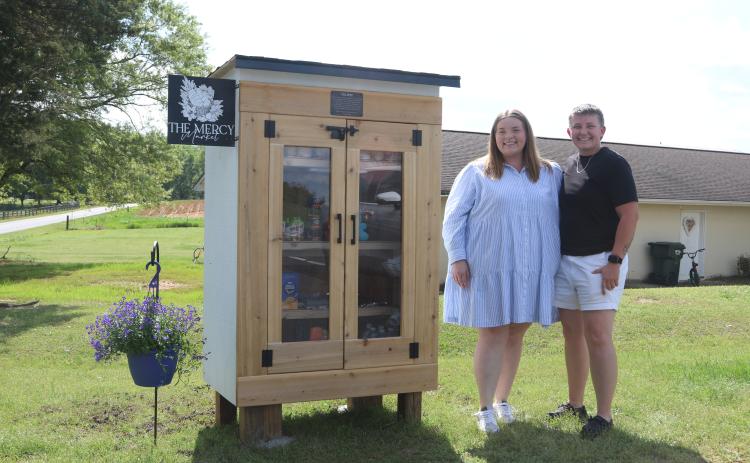 Victoria LeCroy (left) and Brooke Bango (right) founded the Mercy Market to fight poverty and food insecurities in their community. The market is based on a system of trust, where community members can “leave what they can, take what they need.” (Photo/Adriana Cascio)