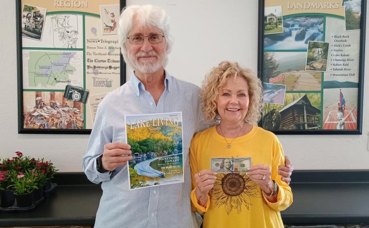 Spring 2025 Lake Living cover winner Morgan Harvill, left, is pictured with his wife, Judy. The magazine cover features a MasterCraft boat on Lake Rabun in Rabun County at the narrows around September 2024. In addition to gracing the cover of Spring 2025 Lake Living, Harvill received $100. (Photo/Megan Horn, The Clayton Tribune)