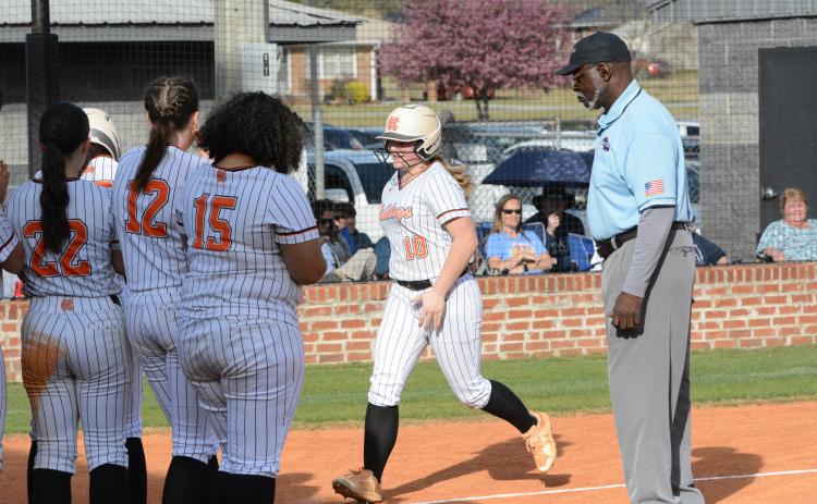 Peyton McCollum (10) trots around the bases after a two-run home run in the 17-6 loss to the Lady Devils of Elbert County in game one, and then Hart proceed to win game two, 13-8. (Photo/Benjamin London)