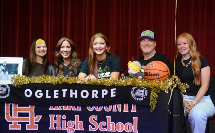 Pictured is Channing Segars (third from left) alongside her family after signing with the Stormy Petrels of Oglethorpe University on March 25 from the Lonnie Burns Fine Arts Center on the campus of Hart County High School. (Photo/Benjamin London)