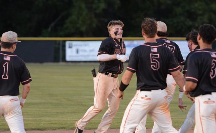 Freshman infielder Slate Osborne (left) walks it off in the 4-3 win in game two on April 25. (Photo/Benjamin London)