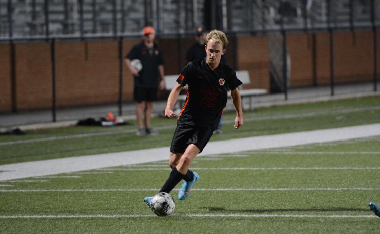 Will Bell scores the lone goal in the 3-1 loss to the Blue Devils of Elbert County on April 15. (Photo/Benjamin London)