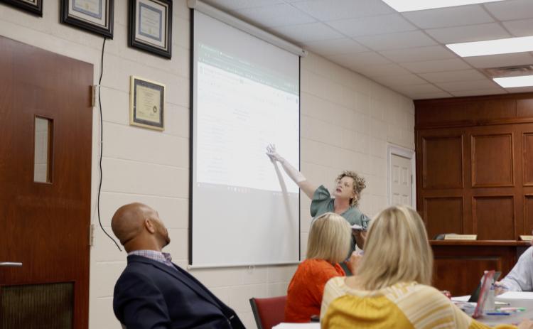 Superintendant Jennifer Carter pointing to a Fiscal Year 2026 tentative budget spreadsheet at Tuesday's budget work session. The Board of Education anticipates a projected $3.2 million total increase from the previous year’s budget. (Photo/Adriana Cascio)