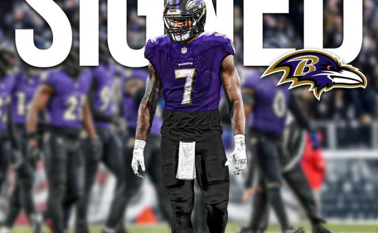 Kaimon Rucker signs with the Baltimore Ravens on May 13. (Submitted by Jordan Lay)