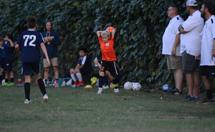 Rhett Simpson throws the ball into play during a home match in September of 2024. (Photo/Benjamin London)