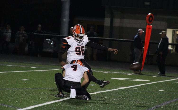 Rising senior kicker German Franco (95) nails a field goal that was held by former Bulldog’s wide receiver Pearce Mewborn in a 40-10 win over the Eagles of East Jackson. (Cheyenne Tolleson/Jackson Harold TODAY)