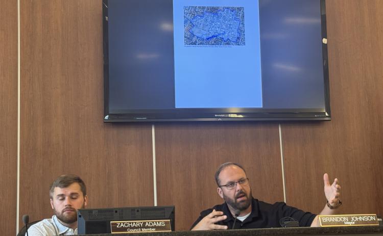 Mayor Brandon Johnson (right) sitting with council member Zachary Adams (left), speaking out to the public about a new rezoning ordinance proposed at Monday's city council meeting. The ordinances are available to the public on the city council website and are not finalized. (Photo/Adriana Cascio)