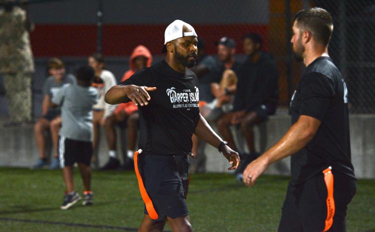 Kendrick Harper (left) celebrates with a teammate after scoring his second receiving touchdown in the 39-35 win over Team Odd in the Harper Island Alumni Game.  (Photo/Benjamin London)