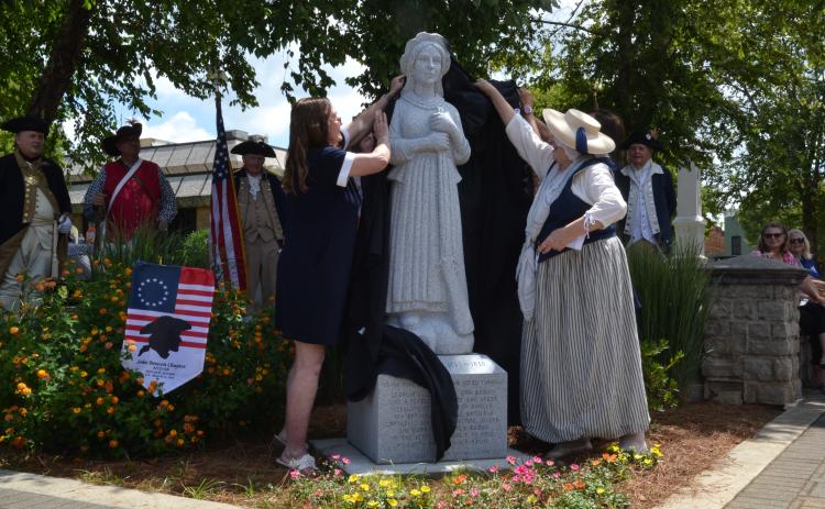 Members of the John Benson Chapter of the Daughters of the American Revolution and local historian and Nancy Hart impersonator Sara Lesseur unveiled the new Nancy Hart statue on June 18. (Photo/Adriana Cascio)