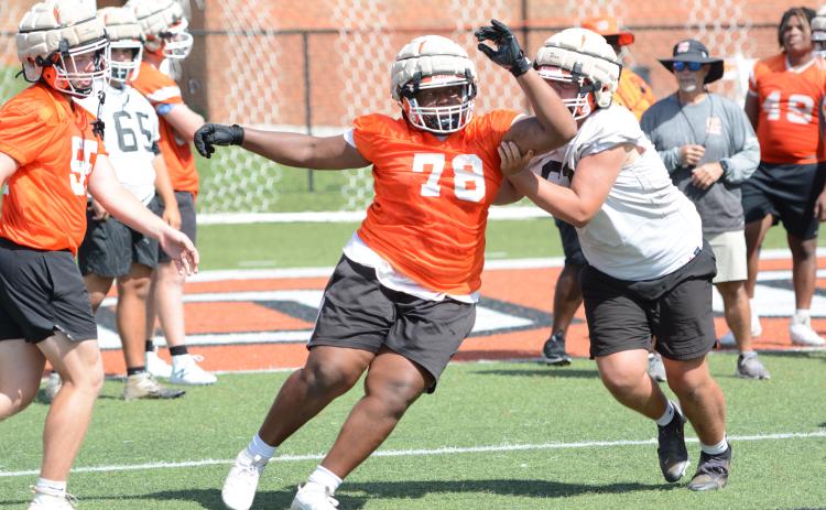 Rising senior defensive lineman Nicholas Carter works on rushing the quarterback. (Photo/Benjamin London)