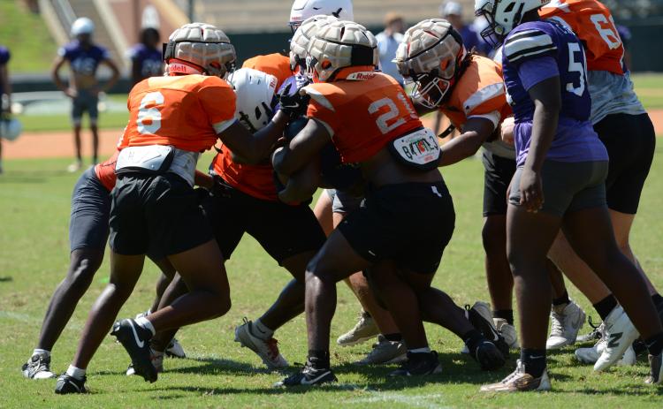 The Bulldogs defense stopping Jasper County’s run game in an 11on11 game. (Photo/Benjamin London)
