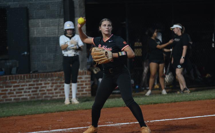 Madi Bennett fields a blunt before throwing the runner out at first during a fast-pitch game in 2024. (Photo/Benjamin London)