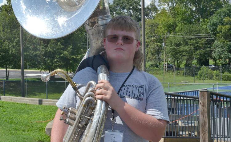 Sousaphonist Kabil Carey holds his sousaphone on his shoulder with pride after being named member of the week for this week’s High Notes series. Carey was selected for his great attitude and dedication to learning during his first marching season. (Photo by Adriana Cascio)