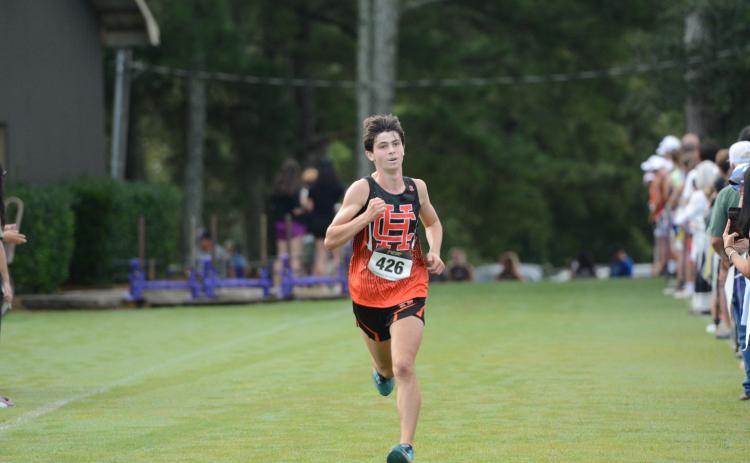 Junior runner Sevyn Singleton placed eighth overall to help the team finish third at Athens Christian Aug. 16. (Photo by Benjamin London)