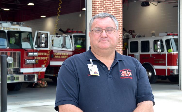 Fire Chief Alan Daniel poses in front of the Hartwell Fire Department, located at 456 E. Howell St., on Tuesday. Daniel is recognized this week as a hero of Hart County for his 41 years of service to the community. (Photo by Adriana Cascio)