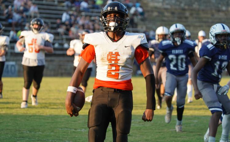 EJ Watkins celebrating after a touchdown run. (Photo by Ric Williams)