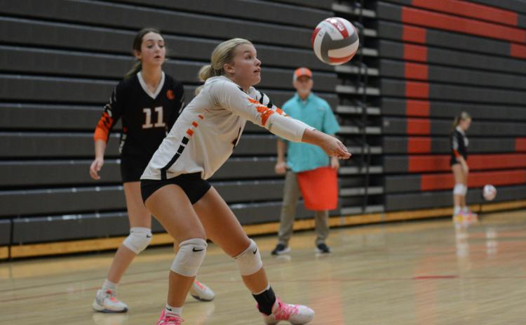 Senior libero Erin Miller sets the ball during the 2-1 win over Madison County Aug. 28. (Photo by Benjamin London)