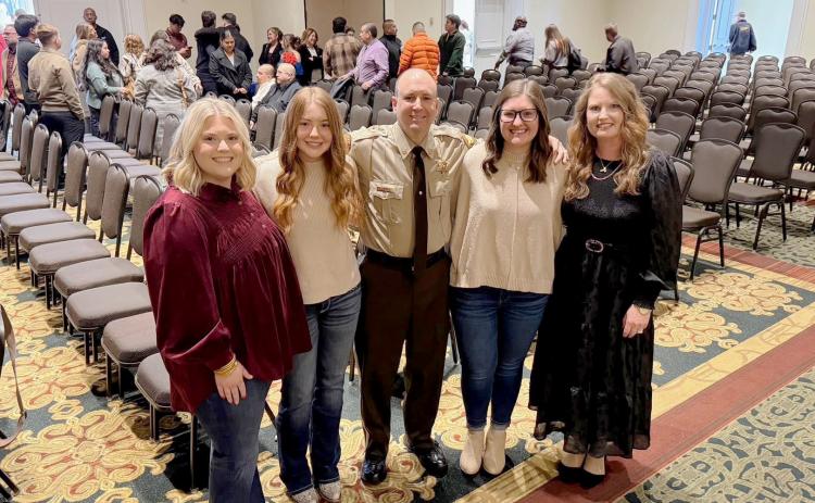 Sheriff’s Deputy Shane Turner stands with his family, his inspiration for becoming a law enforcement officer, during his graduation from the Georgia Public Safety Training Center in December. Pictured are (L-R) Courtney Turner Higgins, Morgan Turner, Shane Turner, Hannah Turner Jones and Jenny Turner. (Photo courtesy of Shane Turner)