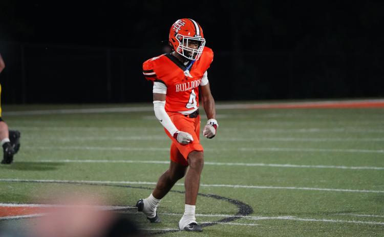 Senior safety Riyan Partlow celebrates after making a tackle for a loss in the 31-28 upset win over the top ranked Wolverines of Prince Avenue Christian Sept. 26. (Photo by Ric Williams)
