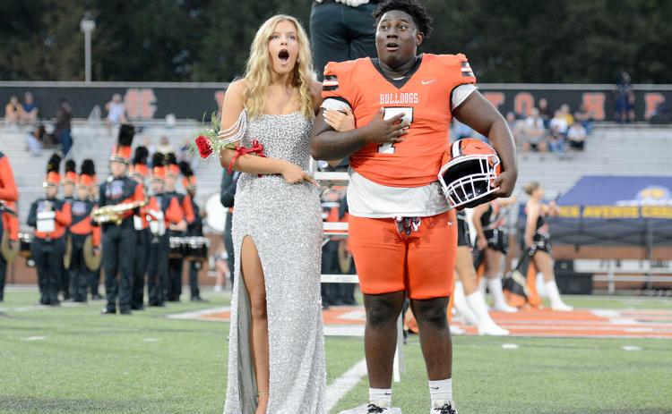 Erin Miller and senior football player Ormani Rucker react as Miller was announced as the 2025 Miss Bulldog prior to the game. (Photo by Benjamin London)