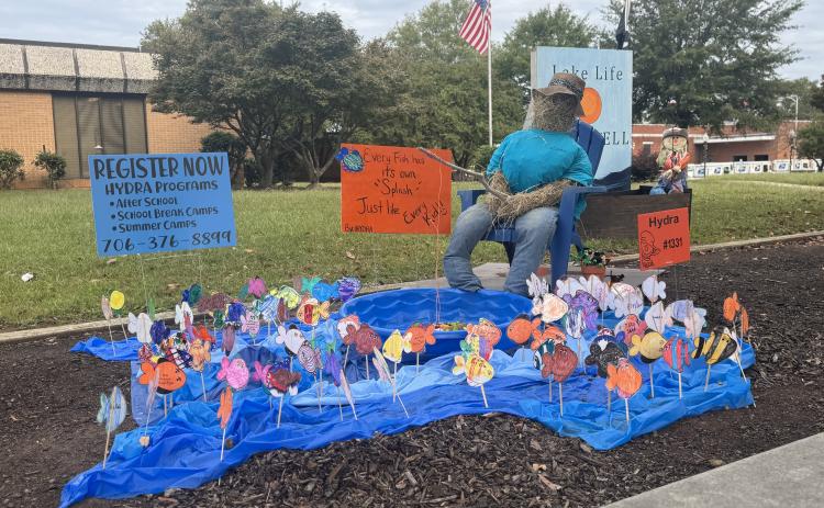 Scarecrows, like the one from HYDRA, have begun to pop up all over town. Voting for the People’s Choice Award is open through Oct. 29. Ballots can be found on page 2 of this week’s paper. (Photo by Adriana Cascio)