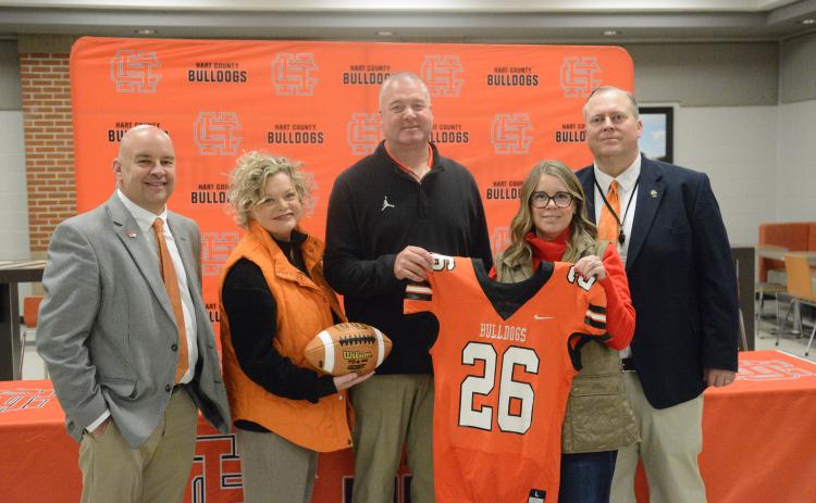Pictured from left is assistant superintendent Brooks Mewborn, superintendent Jennifer Carter, new HCHS head football coach Biff Parson, chair of the board of education Kim Pierce and principal of HCHS Kevin Gaines at the introductory press conference Jan. 15. Photo by Benjamin London.