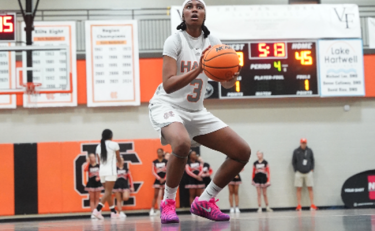 Senior forward Kiasia Montgomery makes crucial free throws late in the game to help seal a double-overtime win against the Lady Wildcats of Woodmont, 59-53, in the North Georgia Report Lake Hartwell Border Battle Jan. 10. Photo by Ric Williams.