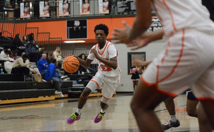 Sophomore guard Terrion Rucker drives to the rim, as he led the team with 17 points in the 57-55 loss to the Lions of Luella Dec. 30. Photo by Benjamin London.