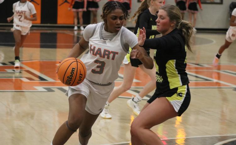 Photo by Grayson Williams Senior forward Kiasia Montgomery drives inside the paint, as she scored 23 points in the 60-39 win over the Lady Mountaineers of North Murray in the first round of the state playoffs Feb. 24. Photo by Grayson Williams.